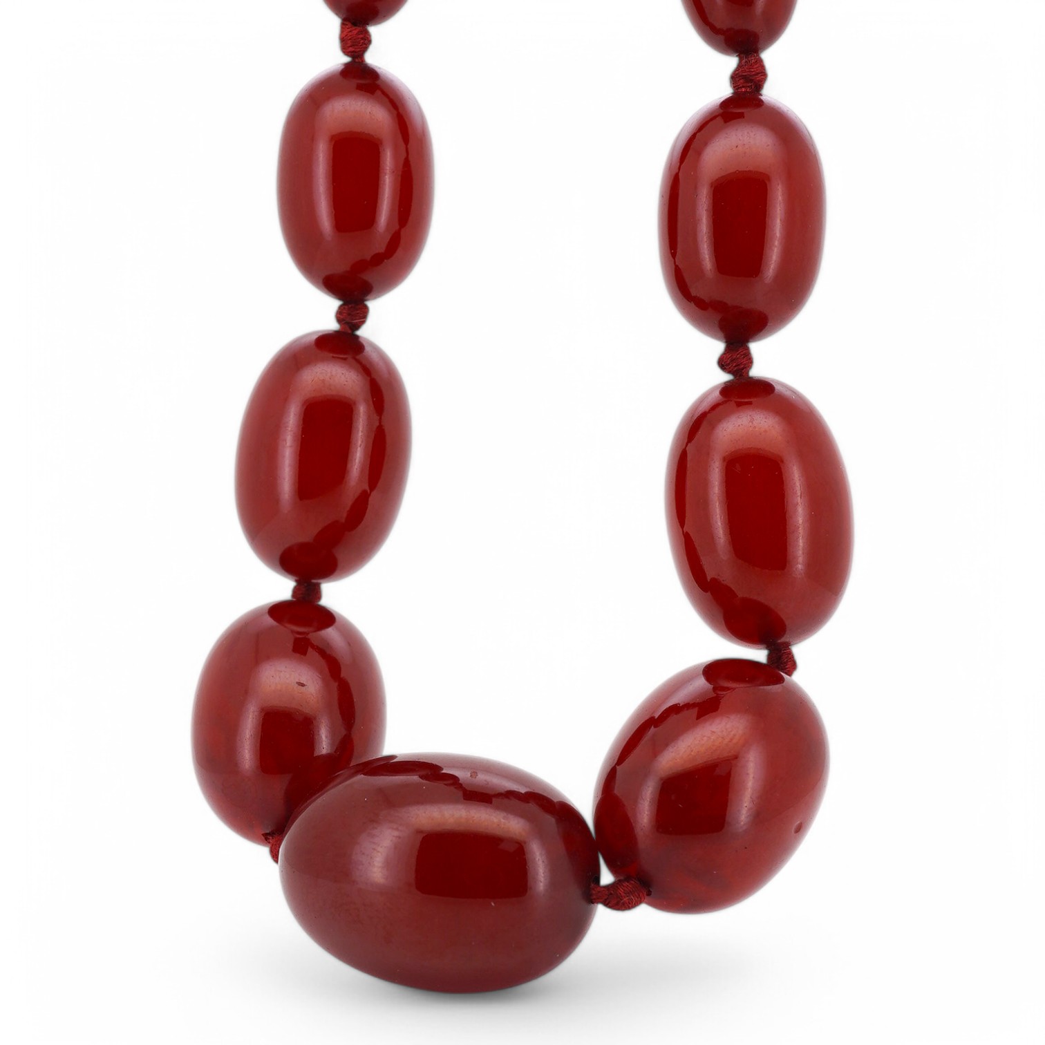 A single strand graduated simulated cherry amber necklace, 46cm, gross weight 58 grams. Condition - fair to good